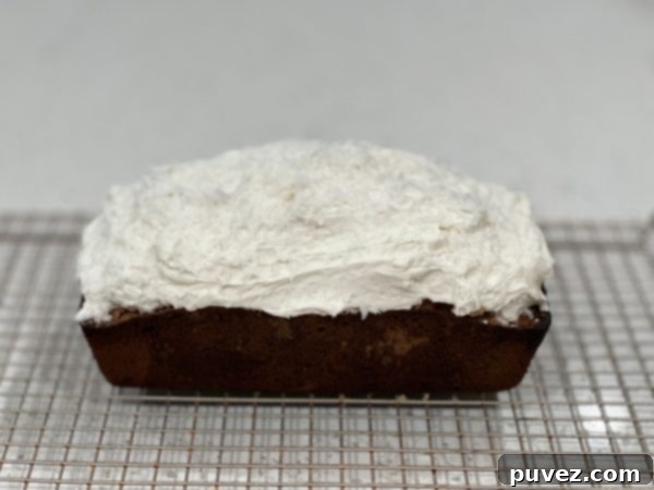 Frosted Coconut Cream Loaf Cake ready to serve