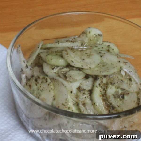 Cucumber and Onion Salad-a summer favorite, the perfect complement to any meal from a sandwiches to steak. www.chocolatechocolateandmore.com