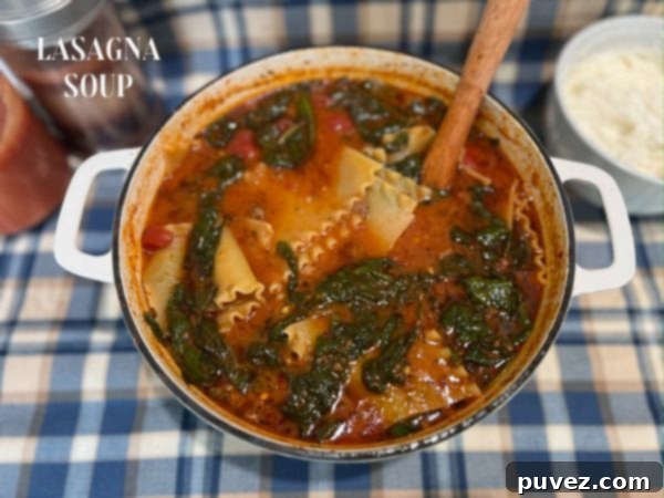 Lasagna Soup, ready to be served with a dollop of cheese