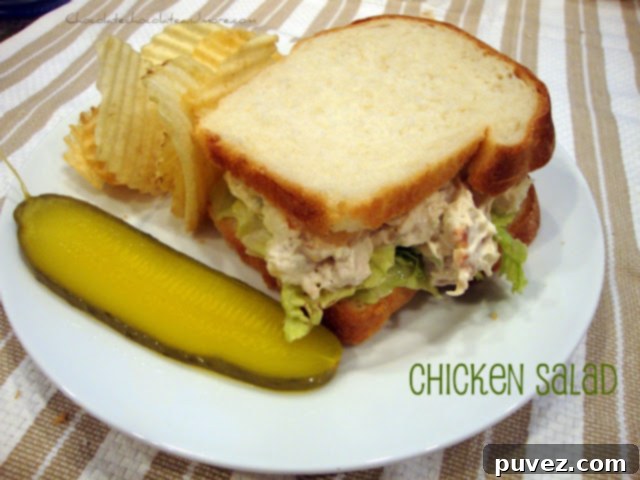 Creamy Homemade Chicken Salad served on a plate with crackers and fresh dill garnish