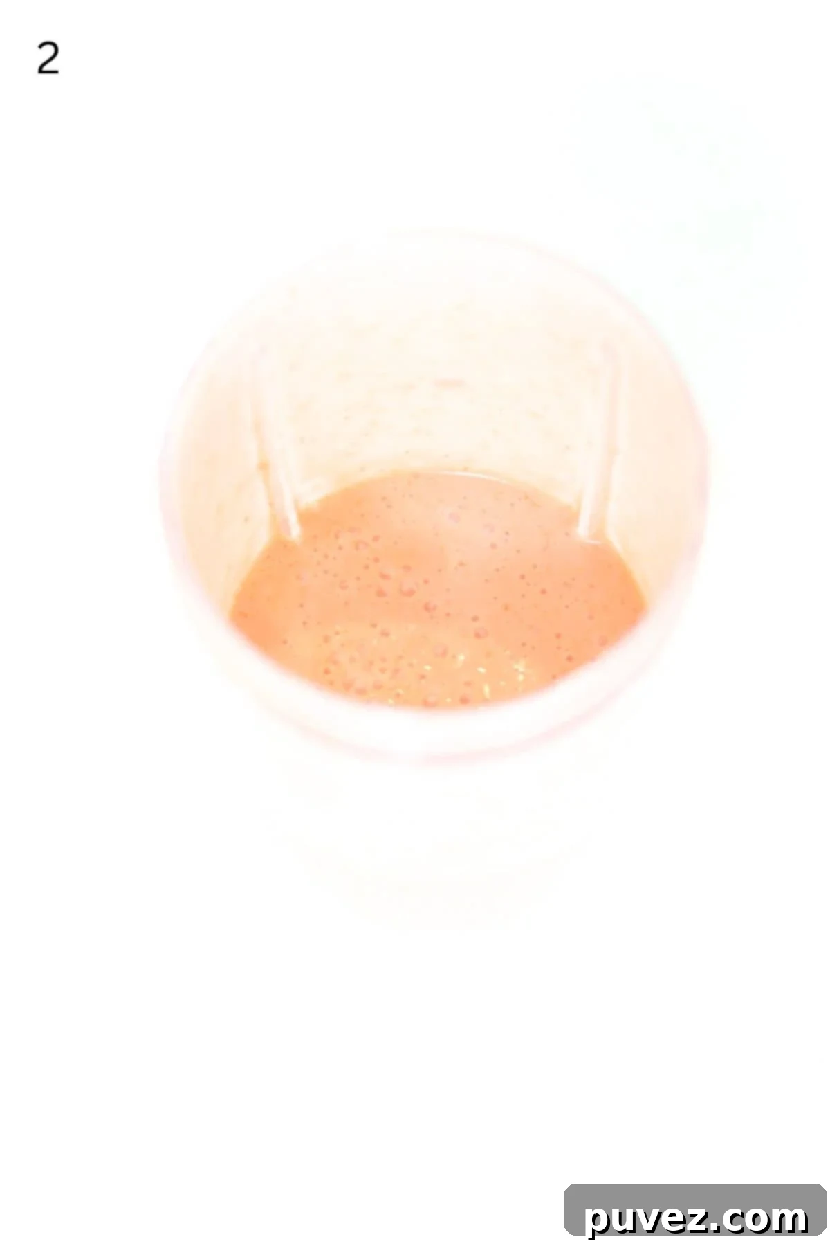 Strawberry salad dressing blended in a Nutri Bullet blender container.