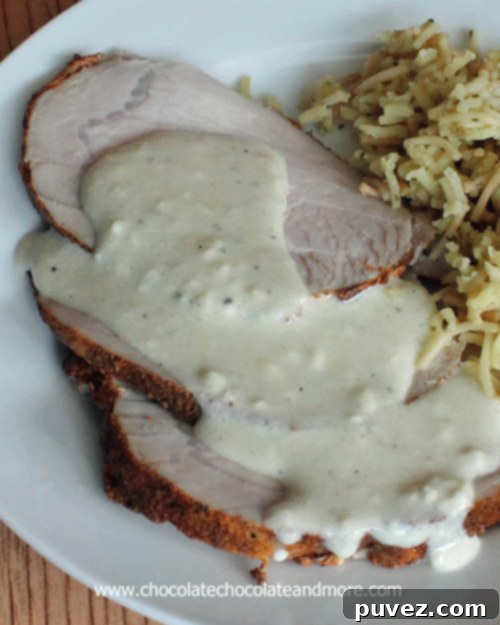 Beautifully sliced smoked pork tenderloin with blue cheese sauce
