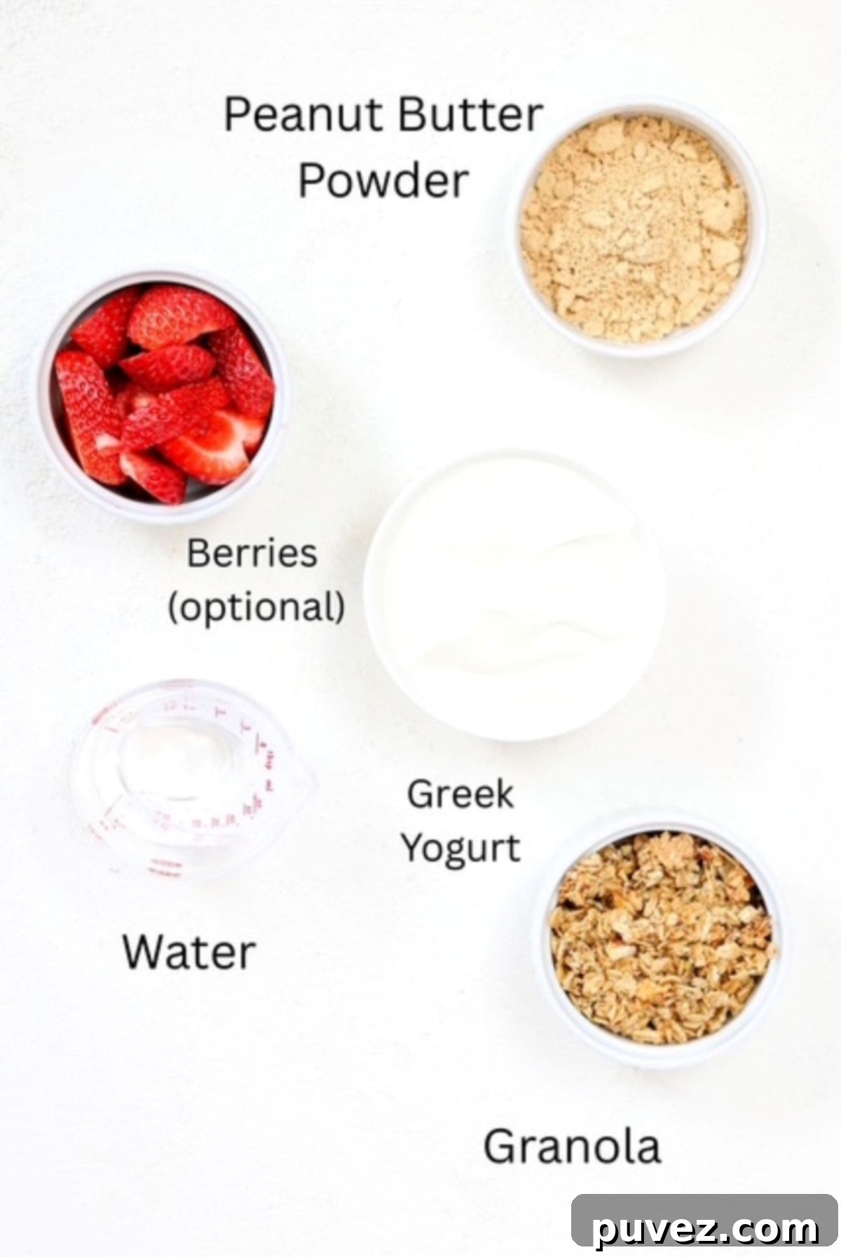 Ingredients for making a Greek yogurt parfait with fresh strawberries, labeled.