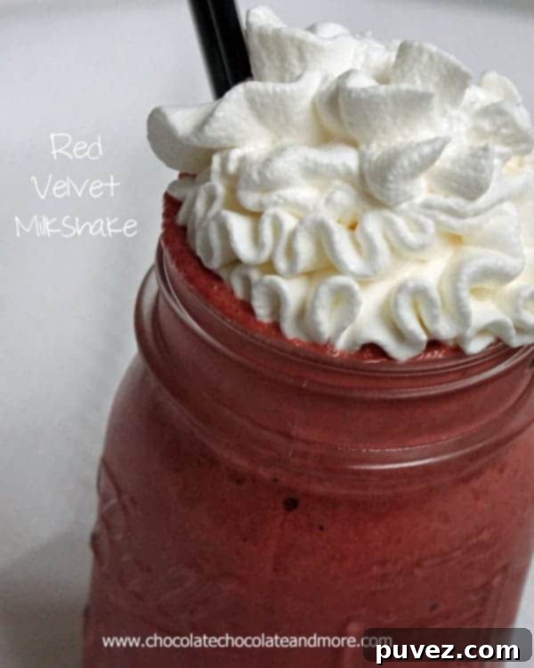 Delicious Red Velvet Milkshake topped with cream, a perfect sweet treat
