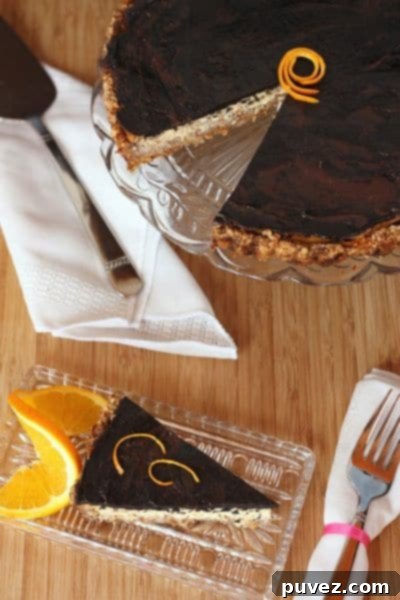 Dark Chocolate Orange Ricotta Tart with Honey Almond Crust, a luxurious blend of chocolate, orange, and ricotta.