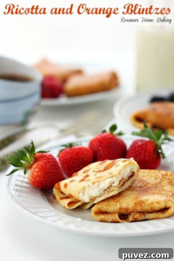 Ricotta and Orange Blintzes, delicate crepes filled with creamy ricotta and orange mixture.