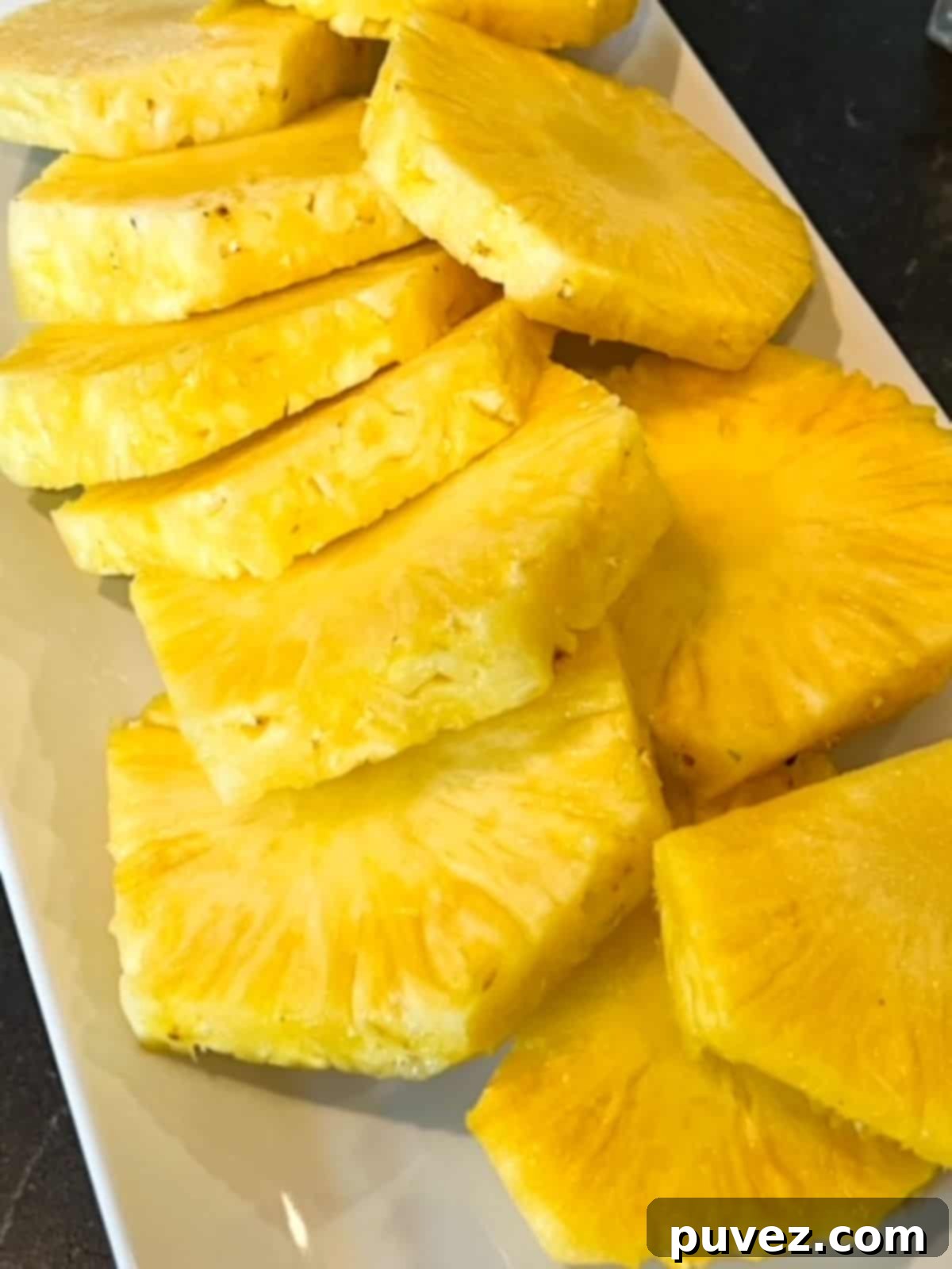 Pick the Perfect Pineapple Every Time 4 Peeled and sliced ripe pineapple rings with the core still in each ring.