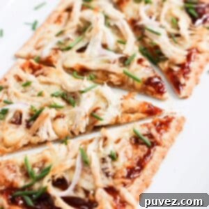 Blazing BBQ Chicken Flatbread in Minutes 6 Four slices of BBQ chicken flatbread pizza up close.