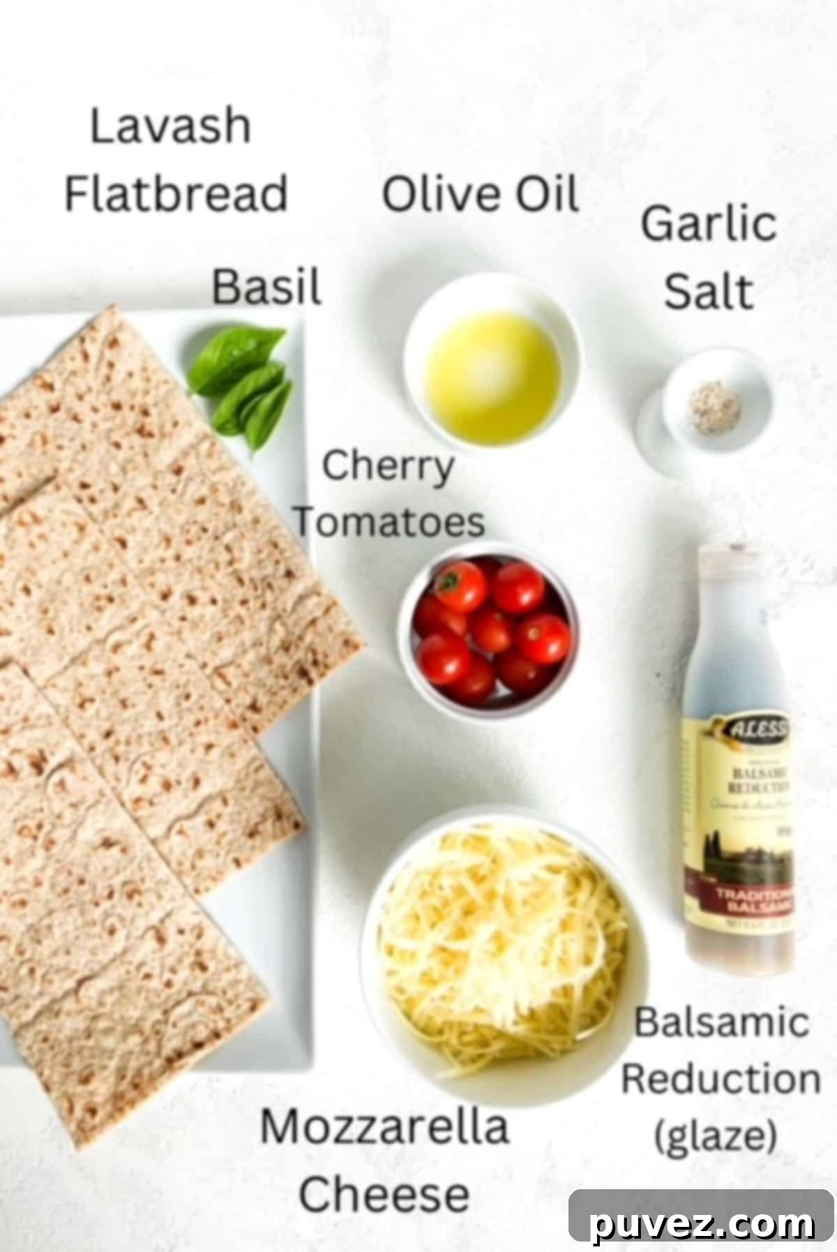 Three slices of flatbread, fresh basil leaves, oil, cherry tomatoes, mozzarella cheese, and balsamic reduction labeled and on a white background.
