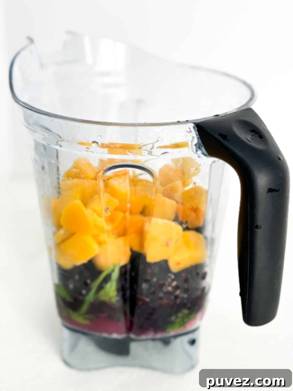 Blueberry Mango Tofu Smoothie ingredients in a Vitamix without the lid on.