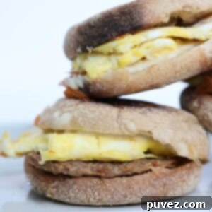 Three breakfast sandwiches stacked.