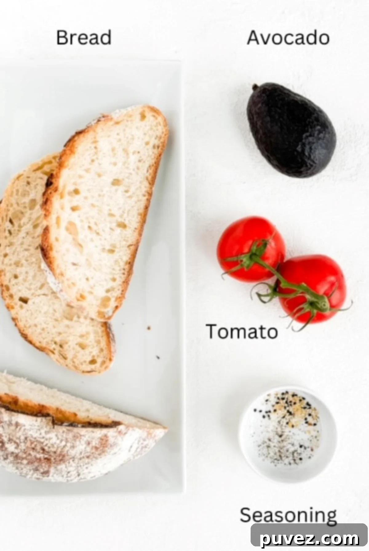 Avocado toast with tomato ingredients laid out on a white surface, neatly labeled for clarity.