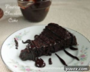 Flourless Chocolate Cake drizzled with Chocolate Ganache, an elegant gluten-free option