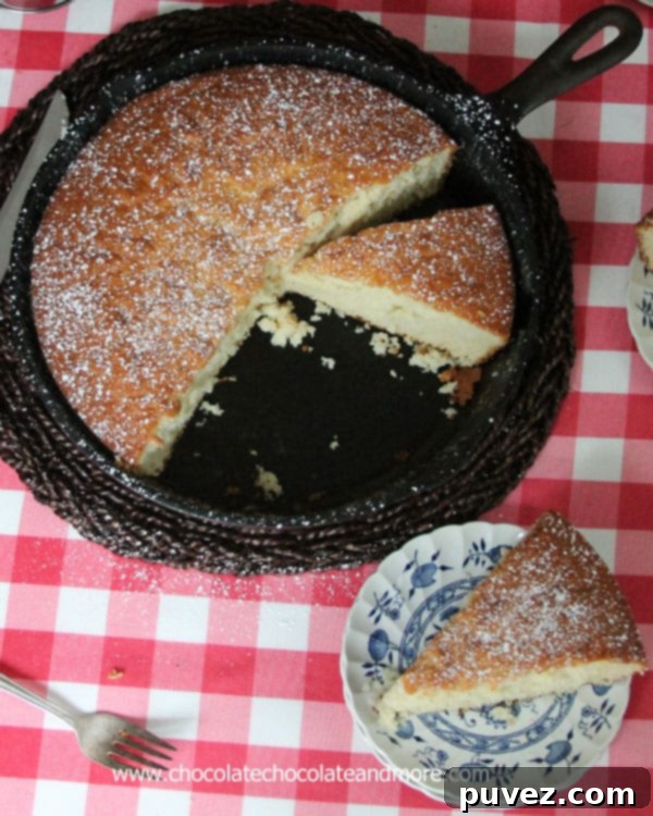 Slice of Old Fashioned Sugar Cake on a plate, showing its light and airy texture