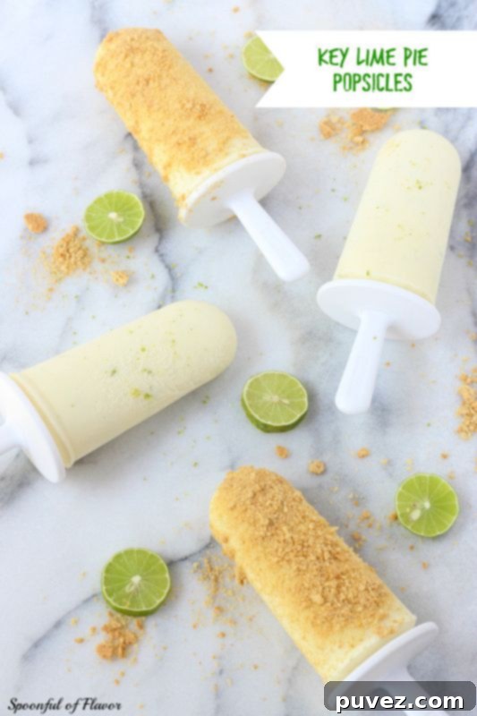 Zesty Key Lime Pie Popsicles, capturing the classic dessert's tangy and creamy flavors in a frozen treat.