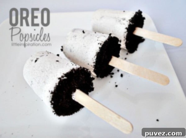 Delicious Oreo Popsicles, a simple and satisfying creamy frozen treat with crunchy cookie pieces.
