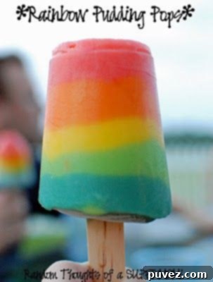 Colorful Rainbow Pudding Pops, a fun and delicious layered frozen dessert for kids.