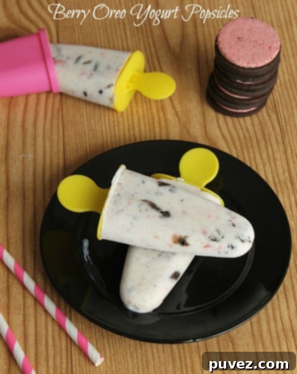 Berry Oreo Yogurt Popsicles, a delightful blend of creamy yogurt, fresh berries, and crunchy Oreo cookie pieces.