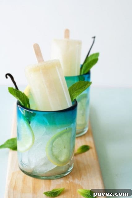 Unique Vanilla-Mint Lemonade Ice Pops, a refreshing twist on classic lemonade with subtle vanilla and mint notes.