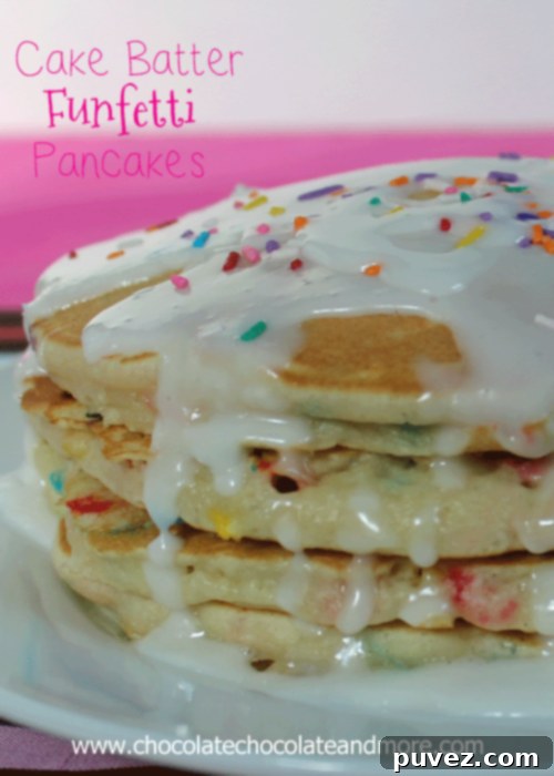 Side view of a stack of Cake Batter Funfetti Pancakes, showing the colorful sprinkles inside