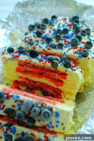 Slices of Red, White, & Blueberry Pop Tart Cake with frosting.