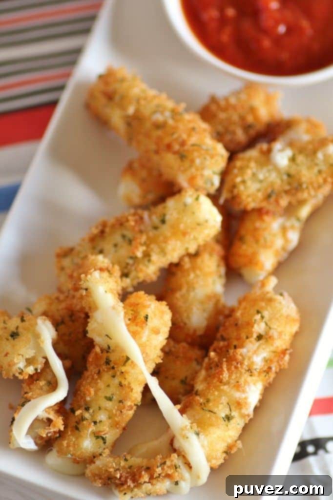 Golden Mozzarella Cheese Sticks, a classic appetizer or snack