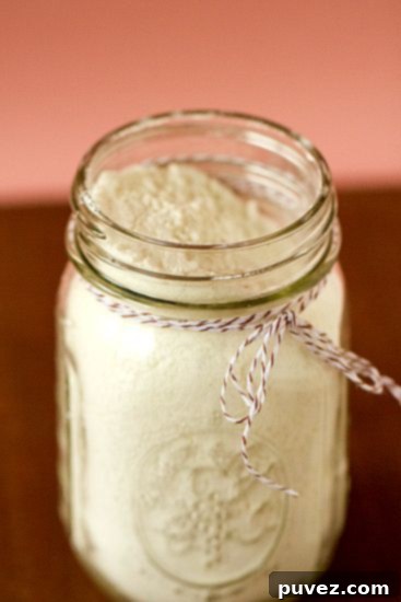 DIY Instant Vanilla Pudding Mix stored in a glass jar.