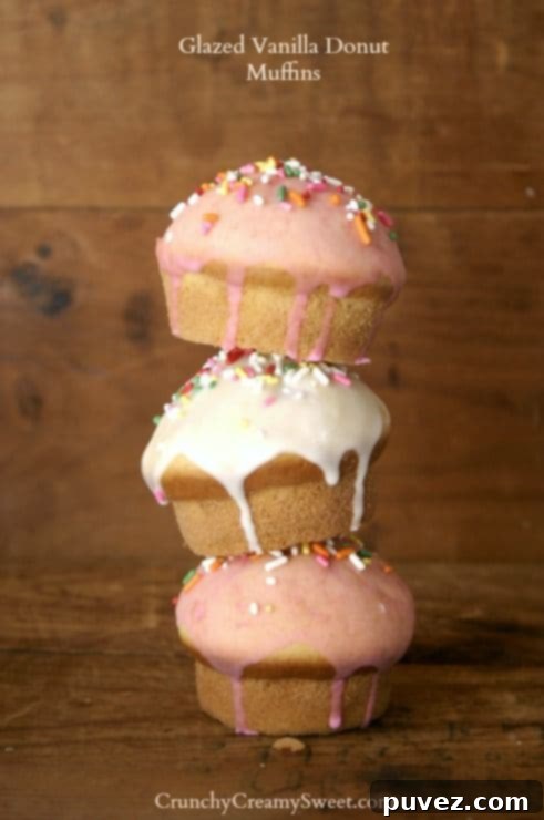 Glazed Vanilla Donut Muffins cooling on a wire rack.
