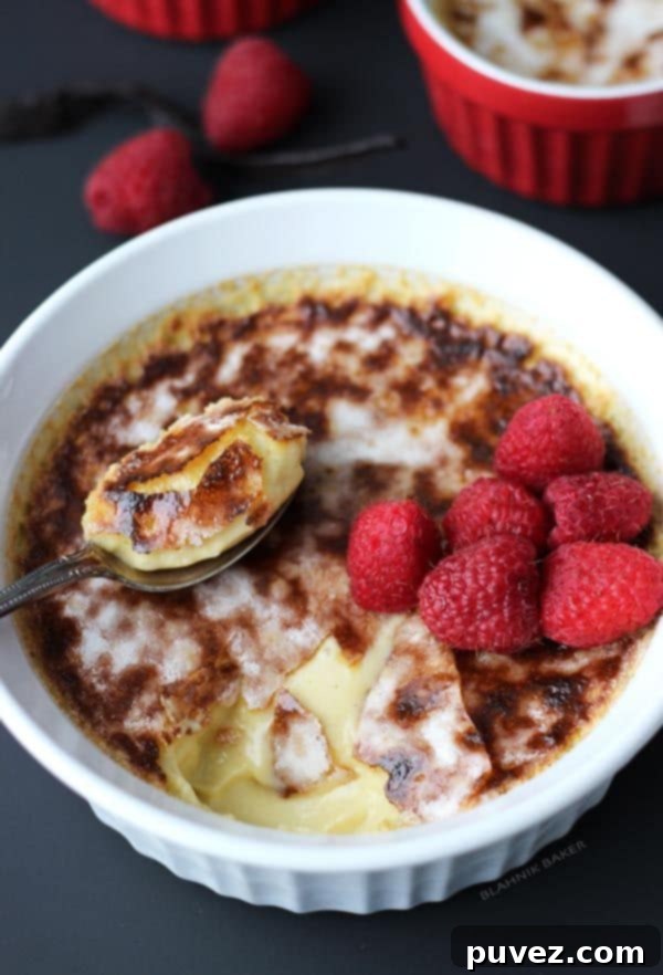 Individual ramekins of Vanilla Bean Crème Brûlée with a golden-brown caramelized top.