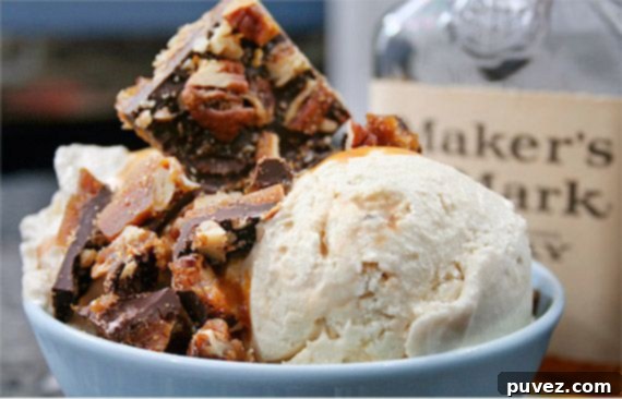 Scoops of Bourbon Vanilla Ice Cream garnished with a vanilla bean pod.