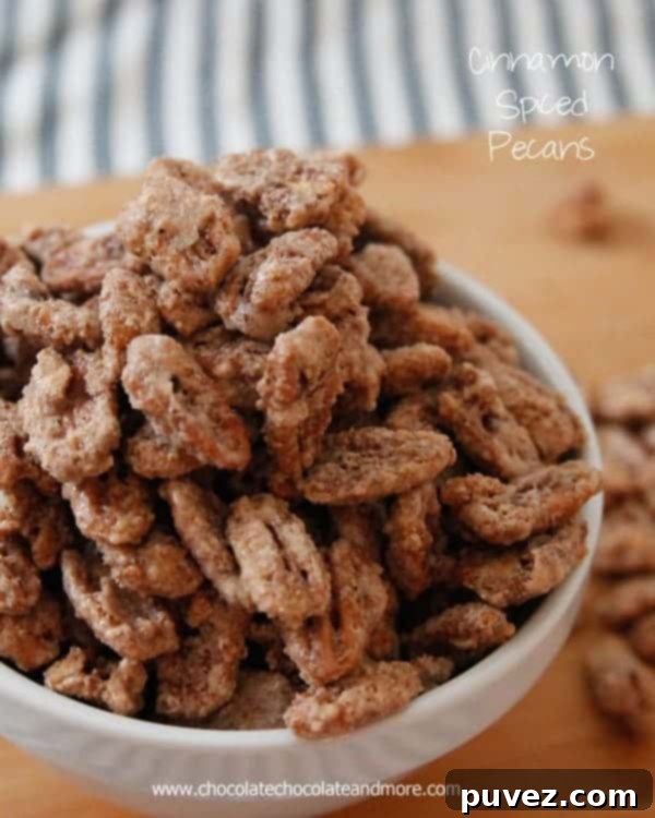 A bowl of delicious Cinnamon Spiced Pecans, perfectly coated and ready to eat.