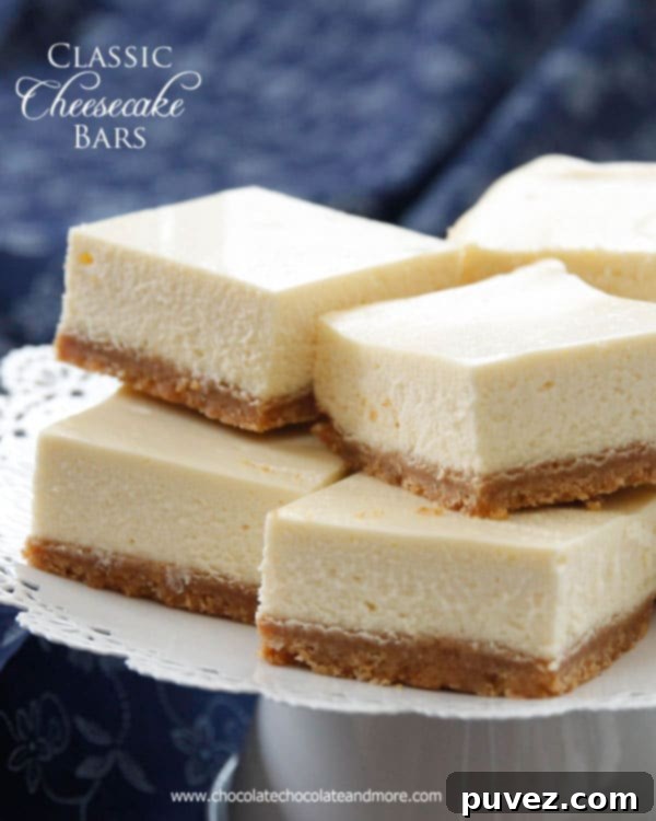 Classic Cheesecake Bars, featuring a creamy filling and traditional graham cracker crust, ready to be enjoyed.