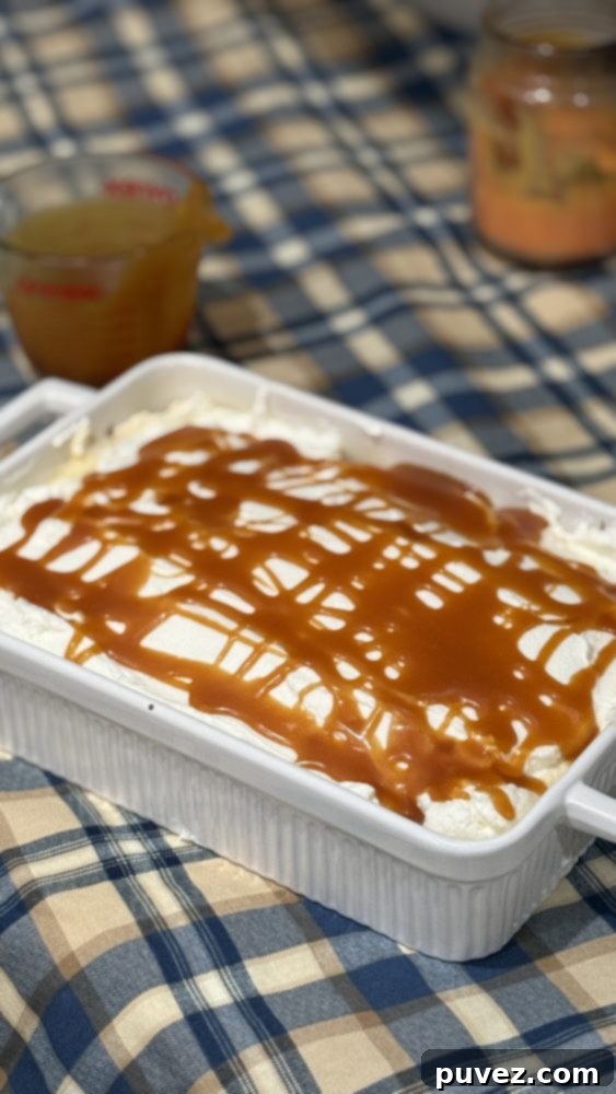 Caramel Tres Leches Cake Soaking in Milk Mixture